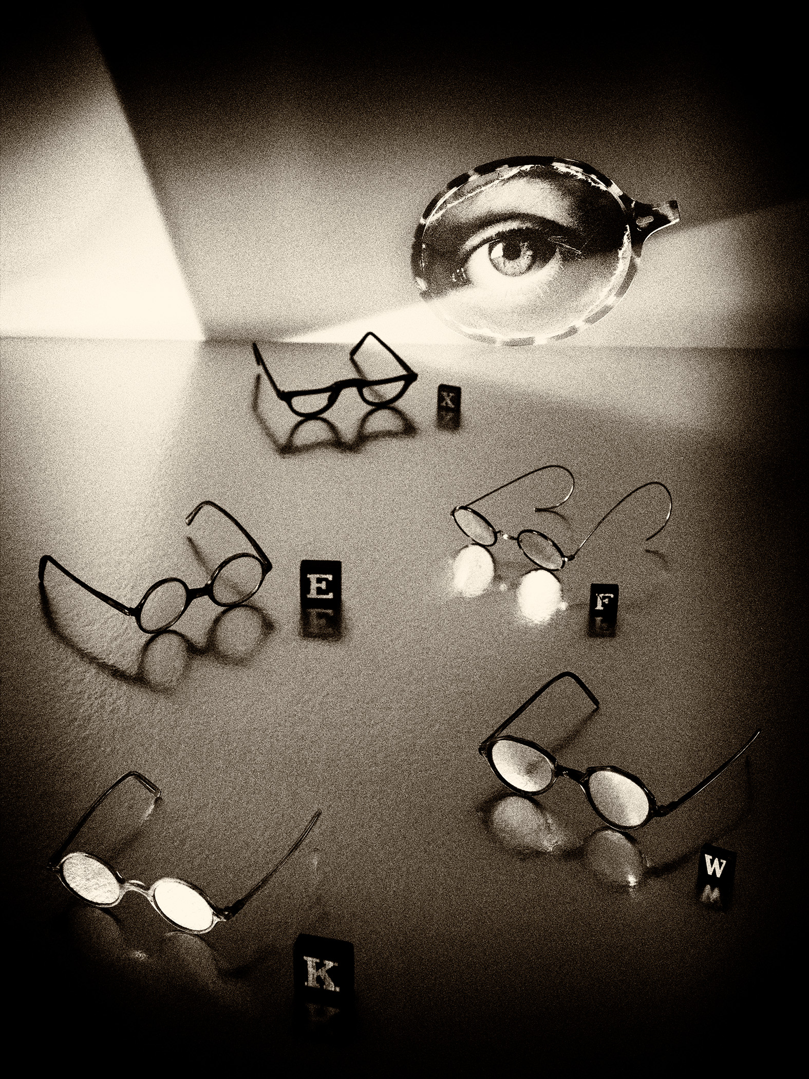 glasses; spectacles; alphabet; letters; optician;sight;vision;lens;lenses;eyes;iris;pupil;surreal;surrealism;metaphor;concept;opthalmologist;reading;
